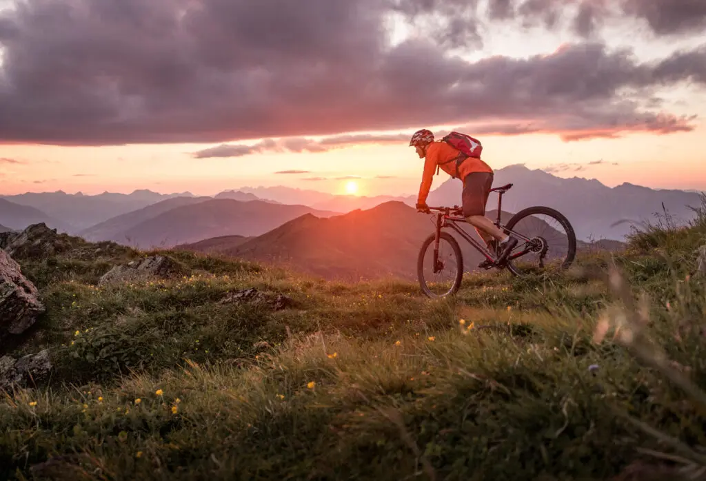 Male,mountainbiker,at,sunset,in,the,mountains Male,mountainbiker,at,sunset,in,the,mountains
